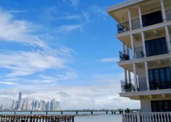 A waterfront building with balconies overlooking the ocean