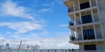 A waterfront building with balconies overlooking the ocean