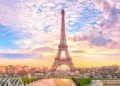 Eiffel Tower at sunset in Paris, France. Romantic travel background