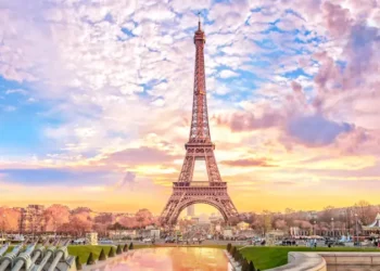 Eiffel Tower at sunset in Paris, France. Romantic travel background