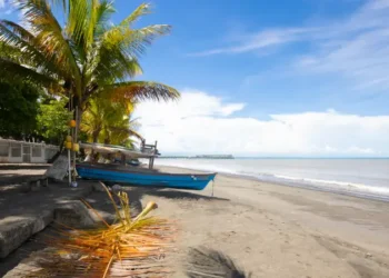 Tropical beach with palm trees in Puerto Armuelles