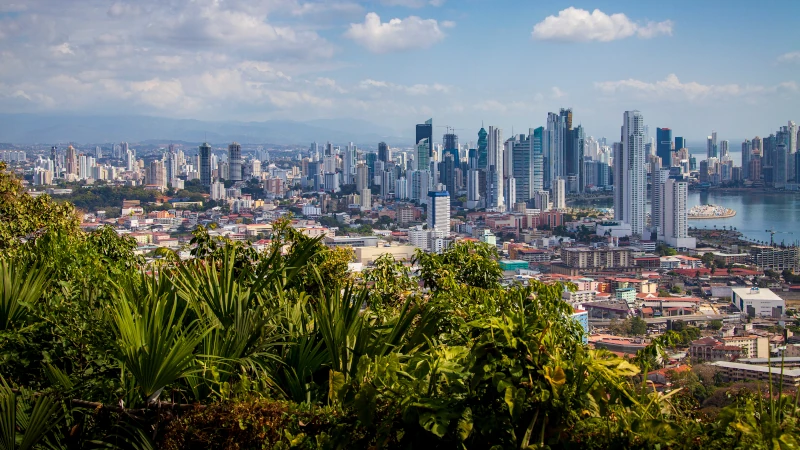 Panama City skyline with modern high-rise buildings representing the tax-free living advantages under Panama’s territorial tax system.