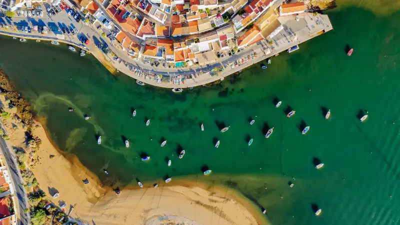 Aerial cityscape of Ferragudo by Arade River, Algarve, Portugal