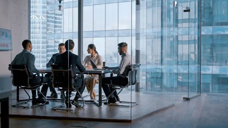business people attending the meeting in boardroom