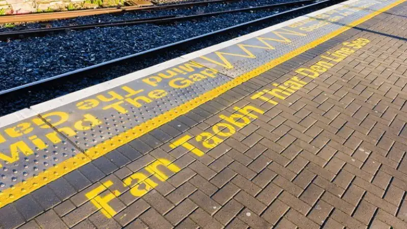 Keep behind the yellow line in Irish