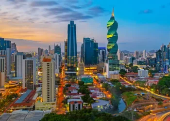 The colorful panoramic skyline of Panama City at sunset with high rise skyscrapers, Panama, Central America.