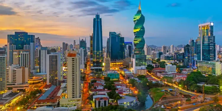 The colorful panoramic skyline of Panama City at sunset with high rise skyscrapers, Panama, Central America.