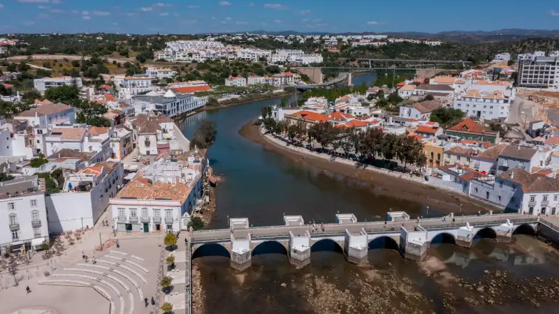 Aerial view of Tavira with historic Roman bridge over the Gilao River