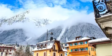 Chamonix town with snowy mountains on the background.