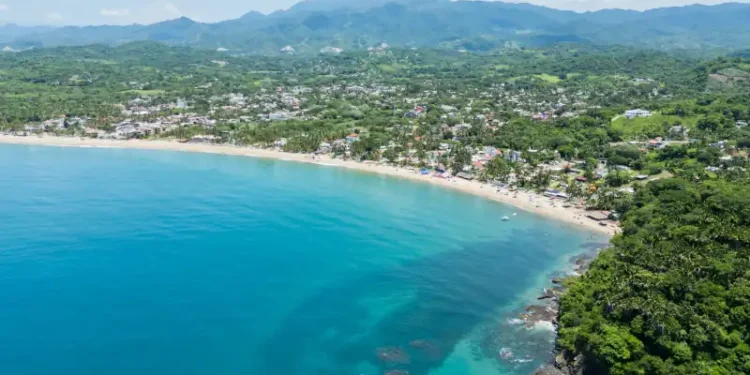 Lo de marcos showing crystal clear waters and sandy beach, a typical mexican village on the riviera nayarit