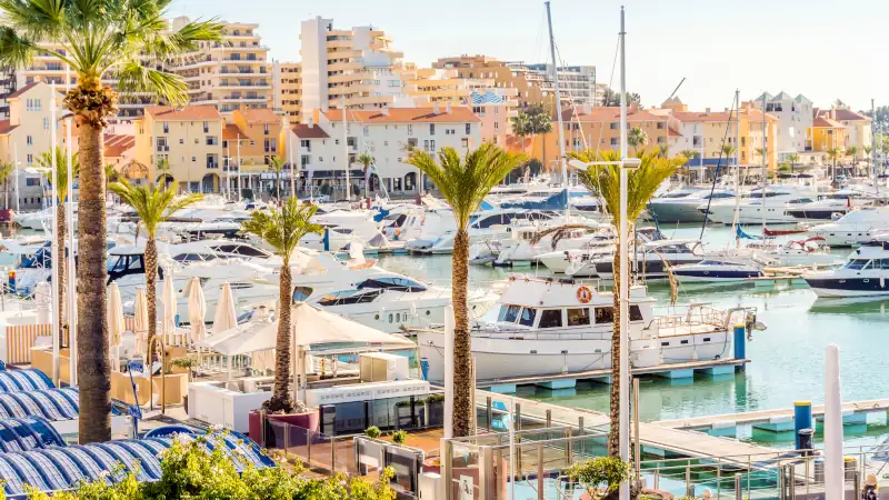 Marina full of luxurious yachts in touristic Vilamoura, Algarve, Portugal