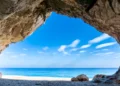 view out of one of the many seaside caves at the beach of Cala Luna in Sardinia