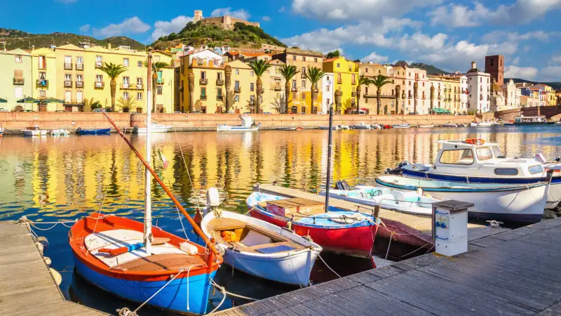 Colorful houses and boats in Bosa, Sardinia, Italy, Europe