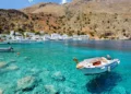 Small motorboat at clear water bay of Loutro town on Crete island, Greece