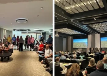 A group of attendees gathers and listens during the Live And Invest In Panama Conference