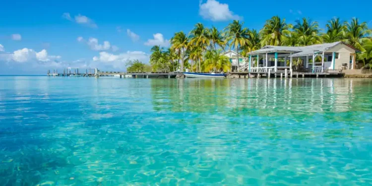 Small tropical island at Barrier Reef with paradise beach