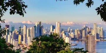 View of the skyline of Panama City framed by tropical rain forest
