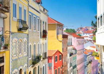 Colorful buildings of Lisbon historic center near landmark Rossio Square