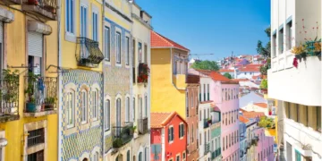 Colorful buildings of Lisbon historic center near landmark Rossio Square