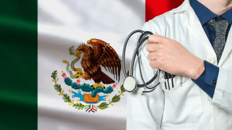 Doctor with stethoscope on arm with Mexico flag behind