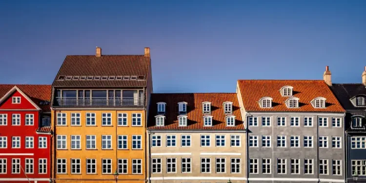 beautiful historical houses against blue sky at sunny day, copenhagen, denmark