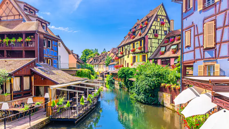 la Petite Venise in old town Colmar city historic centre with old colorful houses medieval buildings on bank of river Lauch canal in summer day