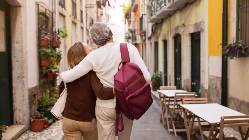 Senior couple enjoying a walk in Lisbon, Portugal.