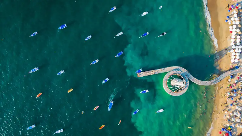 Aerial view of Playa de los Muertos beach in Mexico, ideal for real estate investment.