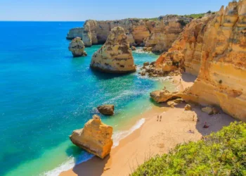 View of beautiful Marinha beach with crystal clear turquoise water near Carvoeiro town, Algarve region, Portugal
