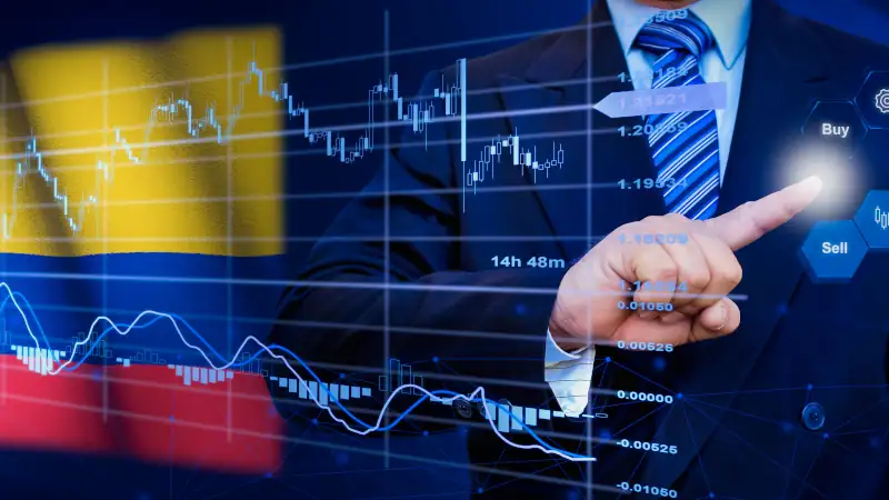 Businessman touching data analytics process system with KPI financial charts, dashboard of stock and marketing on virtual interface. With Colombia flag in background.