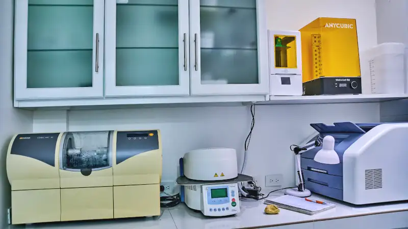 Modern dental clinic equipment in a digital dentistry workspace, indicating high quality care.