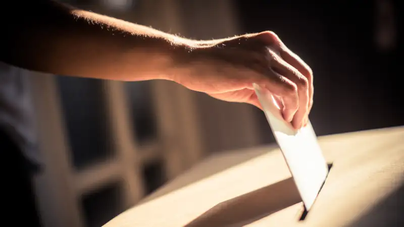 Conceptual image of a person voting during elections
