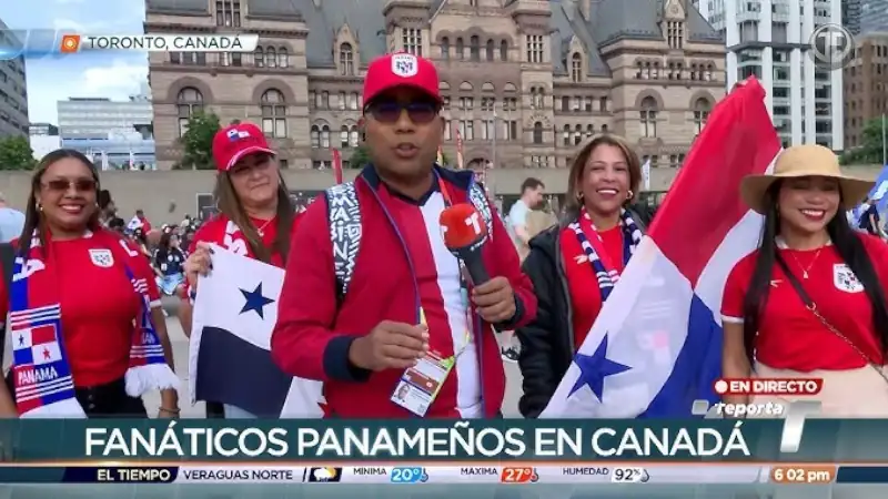 Panamanian soccer fans wave national flags during a live television broadcast in Toronto, Canada, as they support Panama at an international football tournament.