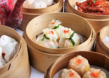 variety of dim sum in bamboo steam containers