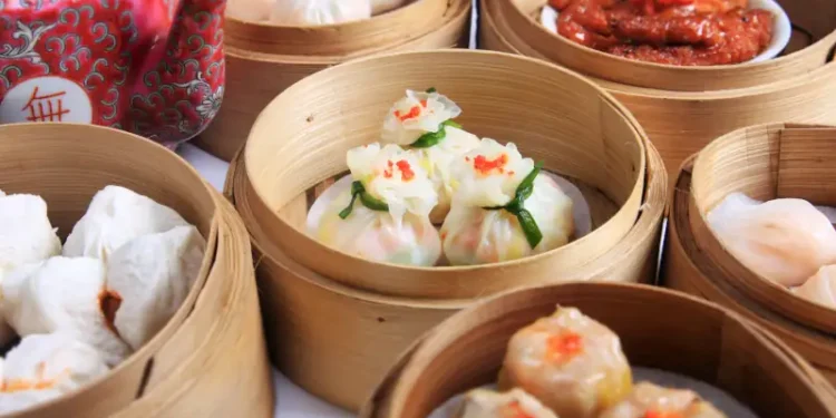 variety of dim sum in bamboo steam containers