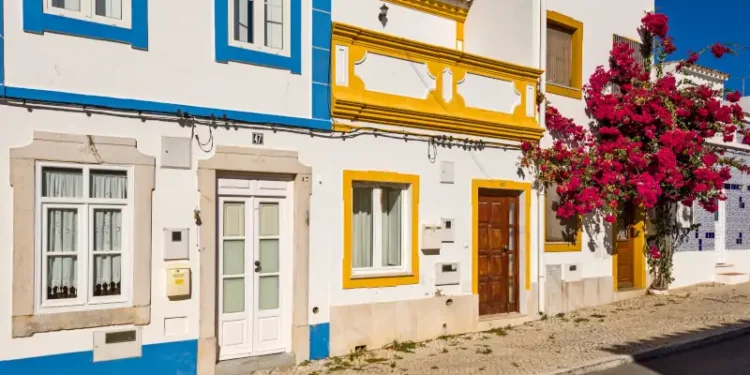 bougainvillea in front of a traditional Algarve house, in Tavira, Portugal