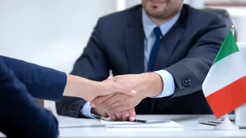 Italian boss signing an employment contract, symbolizing professional life and work opportunities