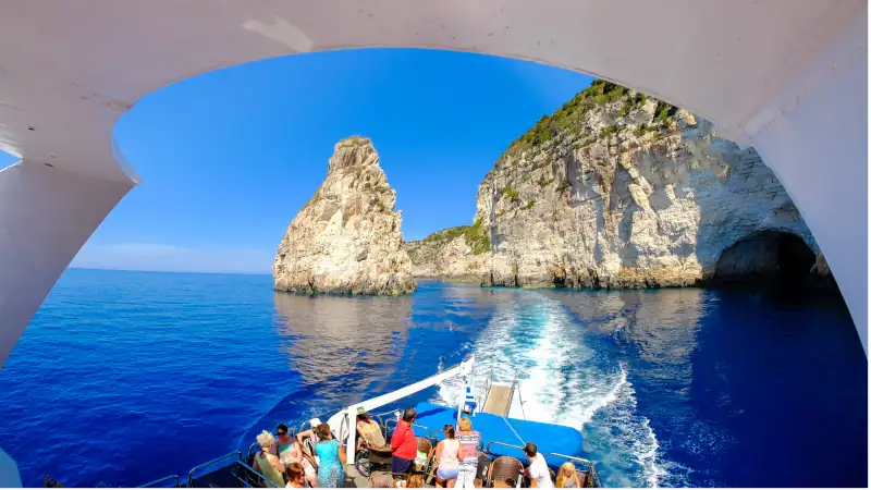 Paxos and Antipaxos island cliff as seen from a daily cruise boa