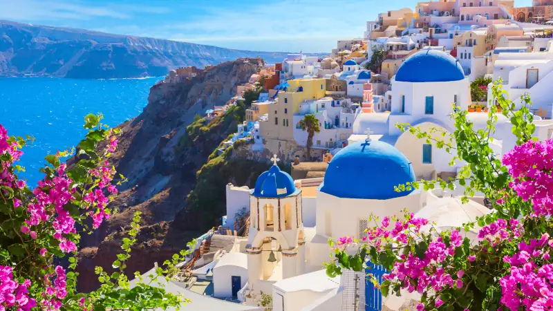View of Santorini island, Greece, showcasing white buildings and blue domes