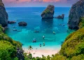 Turquoise lagoon with white coral sand Nui beach. Landscape koh Phi Phi Don island, Krabi, Thailand Aerial drone photo