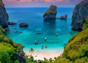 Turquoise lagoon with white coral sand Nui beach. Landscape koh Phi Phi Don island, Krabi, Thailand Aerial drone photo