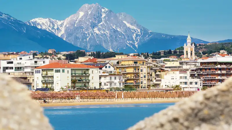 View of the Pescara seafront, with the bell tower of the Divino Amore church and the Gran Sasso