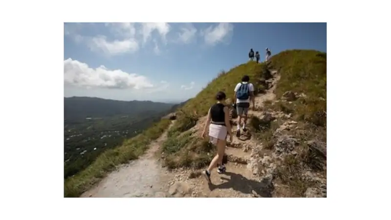 Visitors hiking La India Dormida in El Valle de Antón