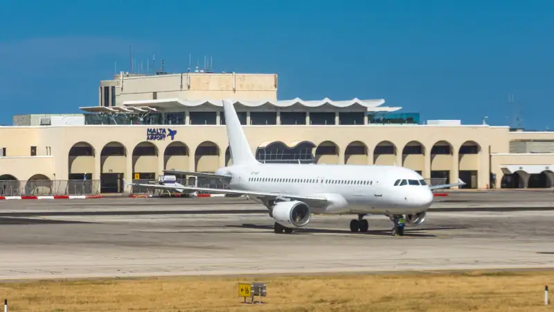 Airplane near the main building of Malta International Airport.