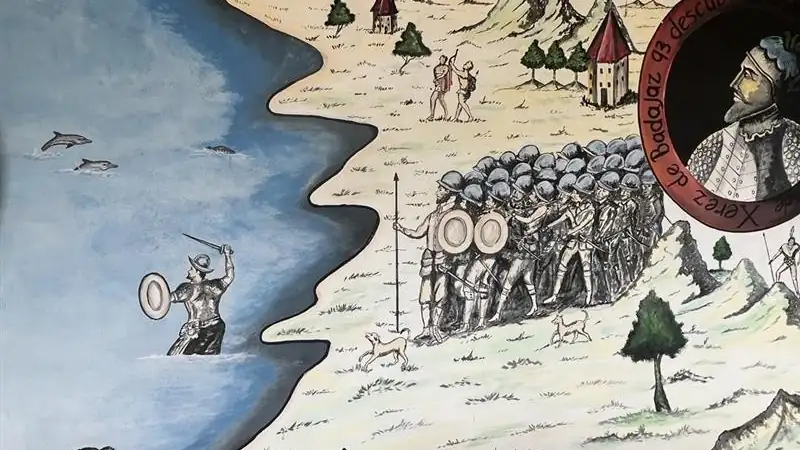 A hand-painted mural illustrating an early exploration and conquest scene along a coastal landscape.