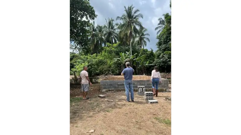 Maestro Moreno, Lief and Kathleen looking at the project site