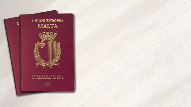 Malta passport on a wooden background