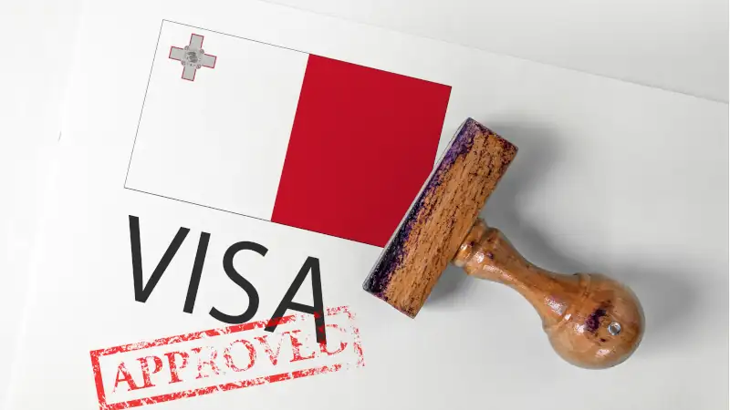 Malta Visa Approved with Rubber Stamp and flag