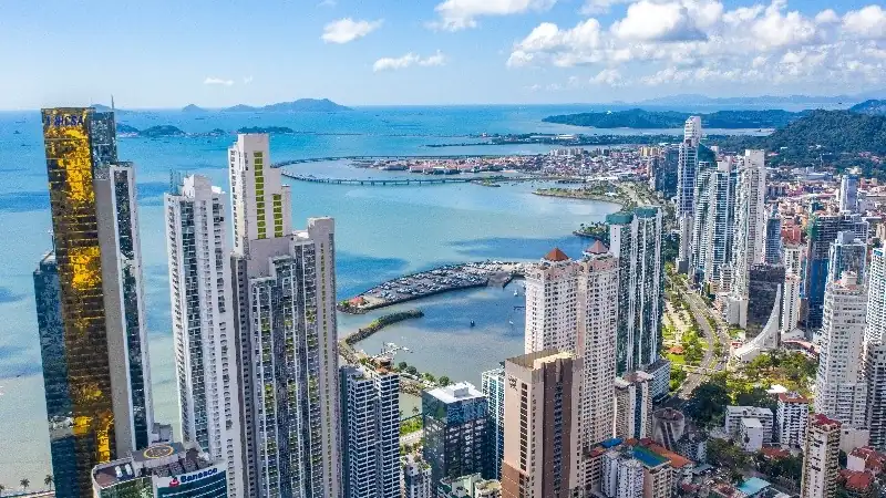 Panama City skyline overlooking the Pacific Ocean and modern waterfront high-rises.