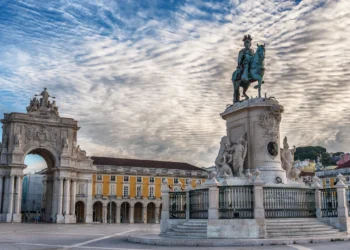 Lisbon, Portugal: the Triumphal Rua Augusta Arch, Arco Triunfal da Rua Augusta, Praca do Comercio and Statue of King Jose I at sunrise